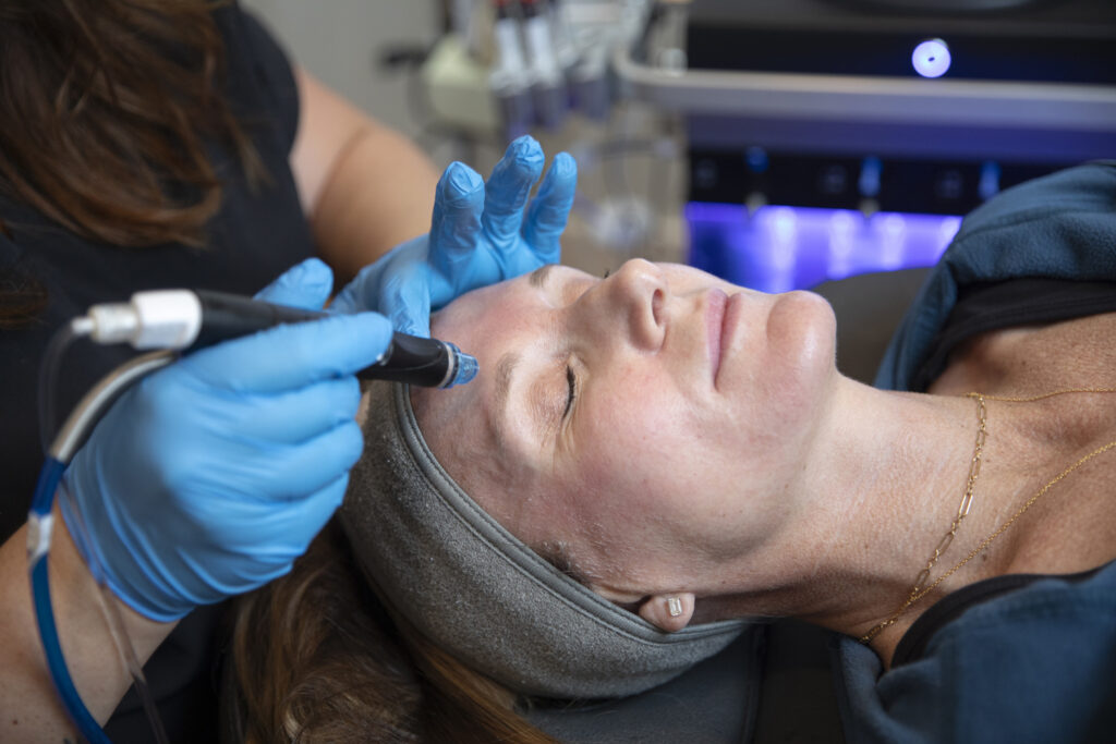 woman receiving Hydrafacial treatment