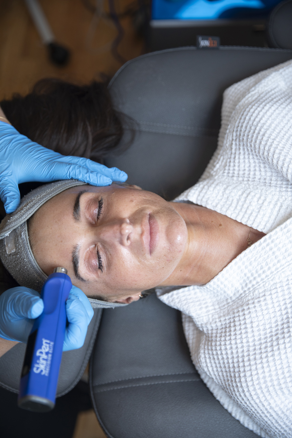 woman receiving SkinPen Microneedling on her face